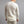 Back view of a man wearing a cream Merino Skins long sleeve thermal shirt