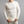 Man wearing a cream Merino Skins long sleeve thermal shirt