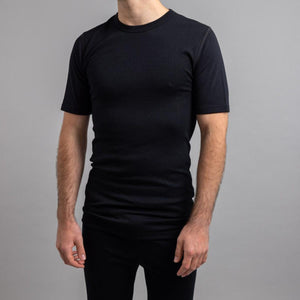 Man wearing a black Merino Skins short sleeve crew neck base layer