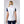 Back view of a woman wearing a white Helly Hansen vest over a navy blue shirt