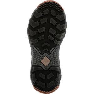 Black rubber lugged outsole of a Muck boot