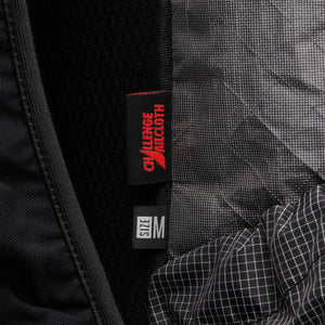 Black Diamond backpack interior showing Challenge Sailcloth fabric label and size M tag