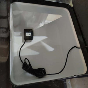 Mattress Cooler water pump with power cord inside a white reservoir
