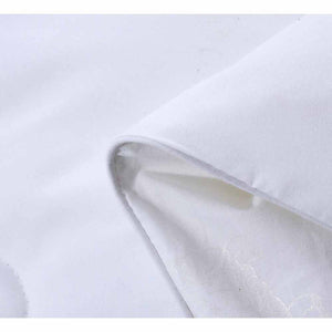 Folded white HealthyLine fabric showing texture and stitching
