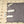 ShieldLife grey quilted heating mat with white power controller on a patterned rug