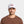 Man wearing a white Mission baseball cap with an American flag patch on the front