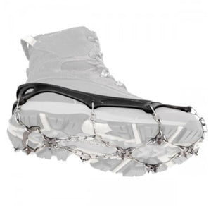 Black rubber traction cleats with metal chains and spikes attached to the sole of a hiking boot