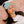 Person wearing an Opal Cool light blue eye mask while resting on a pink pillow
