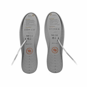 Pair of Glovii heated insoles with size markings and care instructions