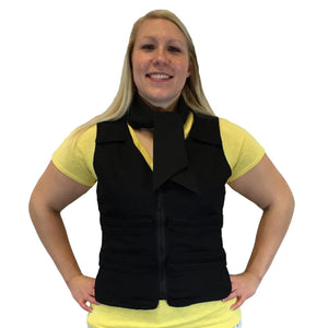 Woman wearing a black cooling vest with a matching neck wrap over a yellow t-shirt