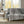 Grey and white patterned electric throw blanket draped over a grey sofa