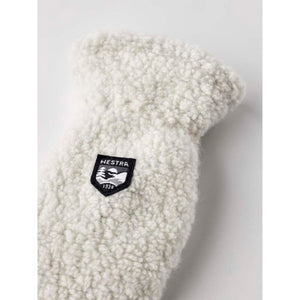 Off white Hestra fleece mitten with black brand logo patch