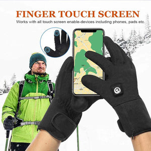 Person wearing black touchscreen compatible gloves using a smartphone in a snowy outdoor setting