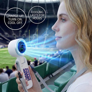 Woman holding a portable Giants branded handheld fan at a stadium