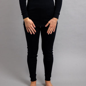 Person wearing black Merino Skins long sleeve top and leggings