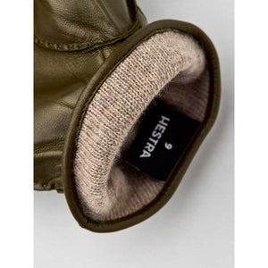 Olive green Hestra leather glove with beige knit lining and size 9 label