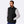 Man wearing a black Mobile Warming fleece vest over a grey long sleeve shirt