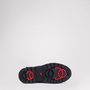 Black Pajar boot sole with red retractable ice cleats