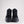 Back view of black Pajar Chelsea boots with thick rubber soles