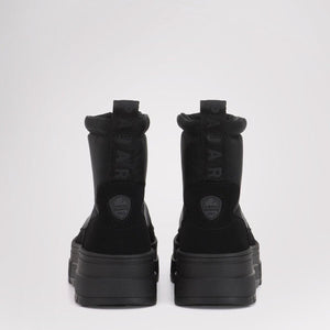 Back view of black Pajar winter boots with thick platform soles