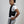 Person wearing an Oro Sports black weighted vest over a white t-shirt