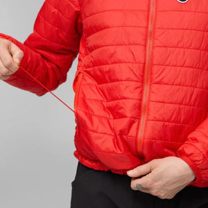 Person wearing a red FjallRaven quilted jacket with a zippered side pocket
