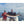 Two men holding a large sailfish on a boat wearing Glacier Glove fishing gear