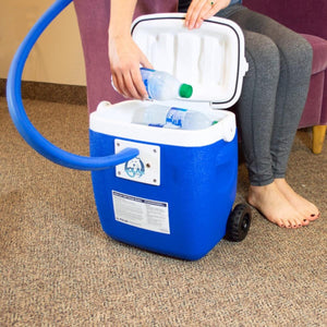 Person placing water bottle into Polar Products blue cold therapy cooler