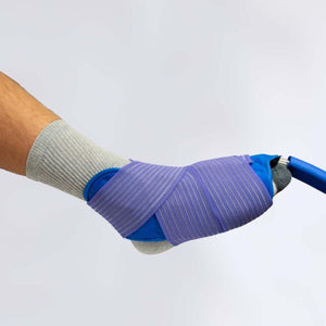 Polar Products ankle cold therapy wrap secured with elastic bandage
