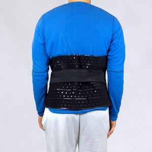 Person wearing a black Polar Products back brace over a blue long sleeve shirt