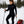Woman wearing black Gobi Heat thermal base layer set while skiing in snowy forest