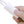 Hand holding a white power cable controller with 3H 6H 9H timer settings and a red indicator light
