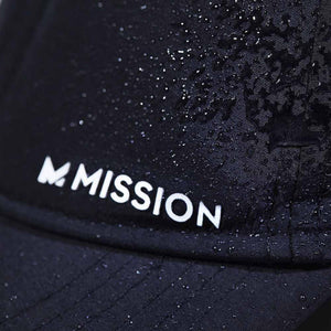 Black Mission cap with water droplets on the fabric surface