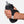 Hand holding a black handheld water bottle with an adjustable strap