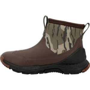 Muck ankle boot with brown rubber base and camouflage upper