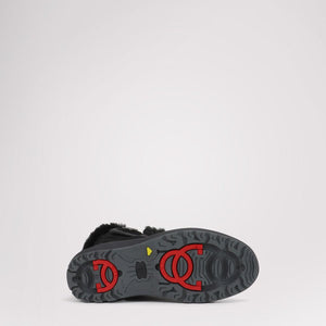 Pajar boot sole with red traction cleats and black tread pattern