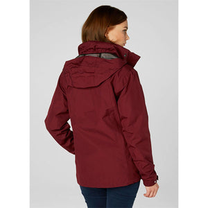 Back view of a woman wearing a Helly Hansen burgundy hooded rain jacket