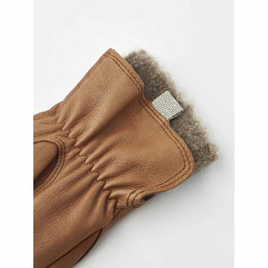 Tan leather glove with grey wool lining and small herringbone tab