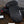 Seirus HeatTouch Hellfire heated mittens and battery pack on a wooden surface