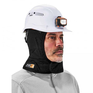 Worker wearing a white hard hat with a headlamp and a black Ergodyne N-Ferno flame resistant winter liner