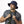 Man wearing a navy Mission bucket hat and a cooling towel around his neck