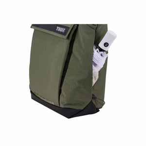 Thule backpack side pocket holding a folded white umbrella