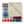 Folded patchwork throw blanket with plaid and striped patterns and cream sherpa lining