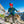 Climber wearing a Black Diamond helmet and jacket handling climbing ropes on a mountain ridge