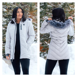 ActionHeat women's grey quilted jacket with faux fur hood in a snowy outdoor setting