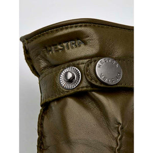 Olive green Hestra leather glove cuff with metal snap button closure