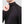 Man wearing a black long sleeve mock neck shirt with ribbed shoulder panels