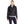 Woman wearing a black quilted Volt heated jacket with a grey turtleneck and dark blue jeans
