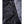 Water droplets on black Heat Experience jacket fabric with zipper detail