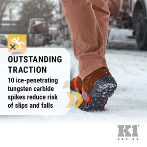K1 Series ice traction cleats with 10 tungsten carbide spikes on a boot walking on snow
